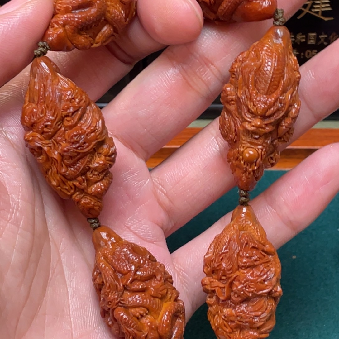 清***落吊坠橄榄核Dhd九龙手持