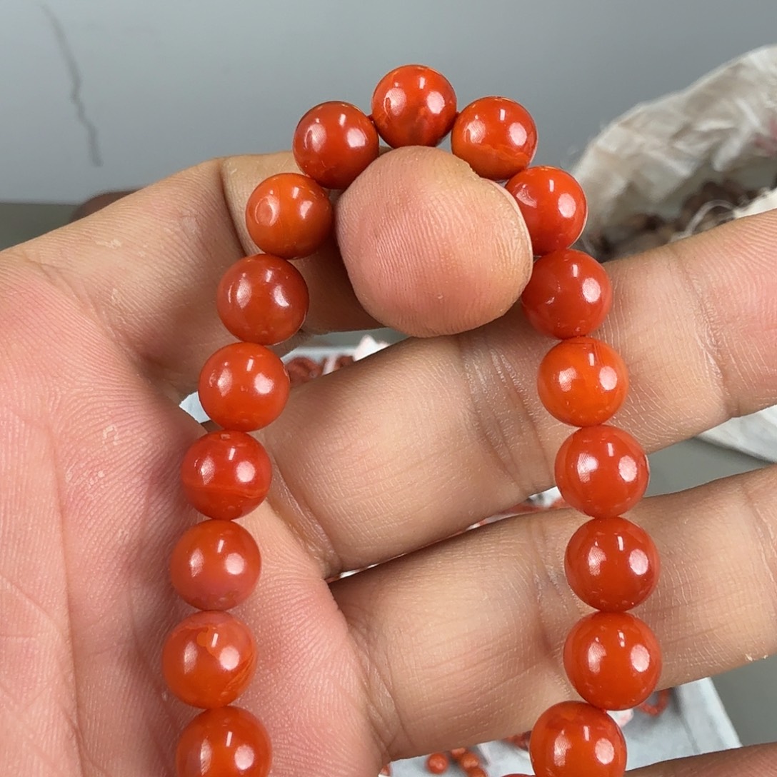 哆***宝南红玛瑙未镶嵌手串柿子红手串