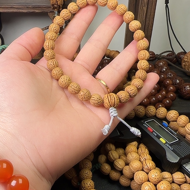 荥***少桃核吊坠桃核手串