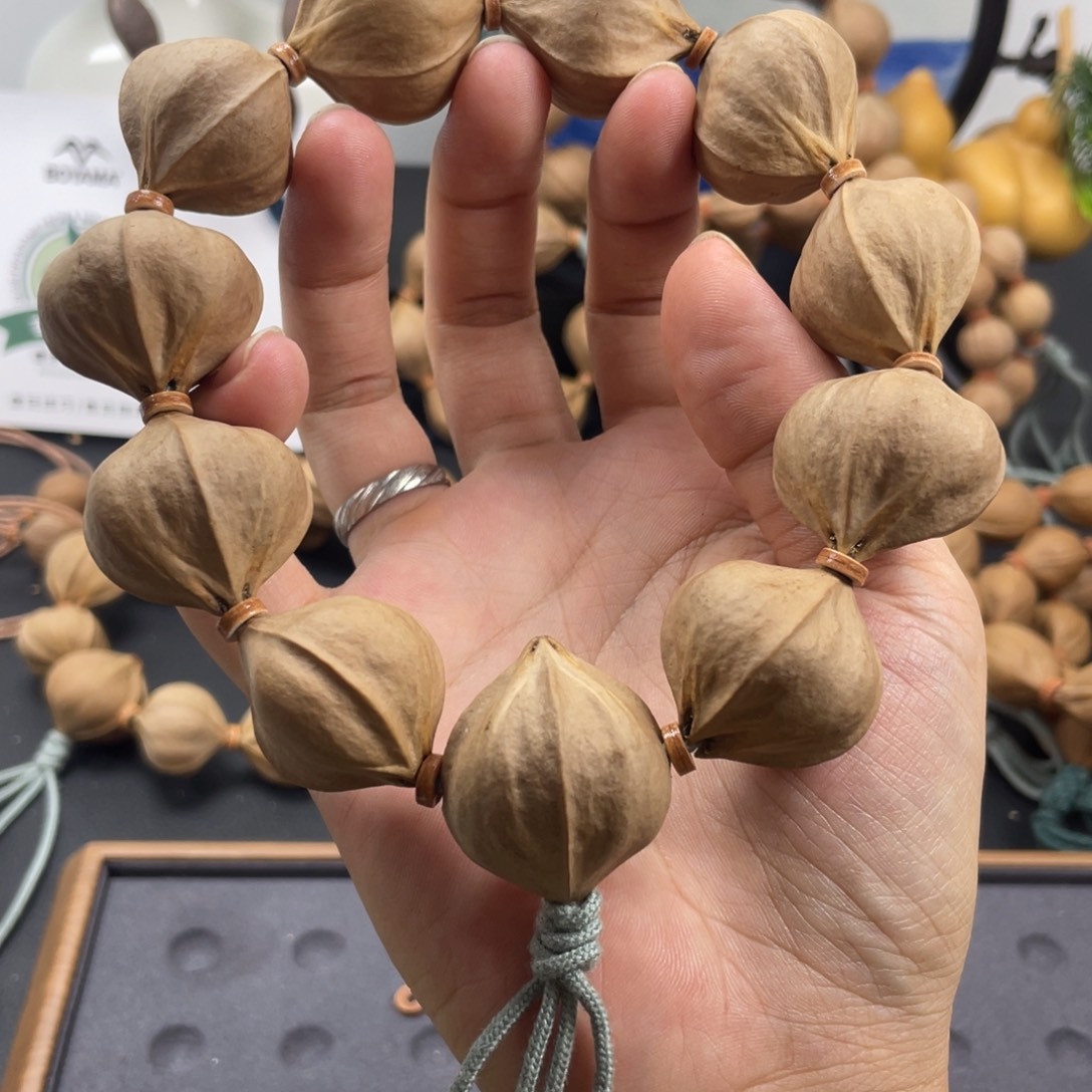 啊***哈木质伯牙马橄榄核铁核四花