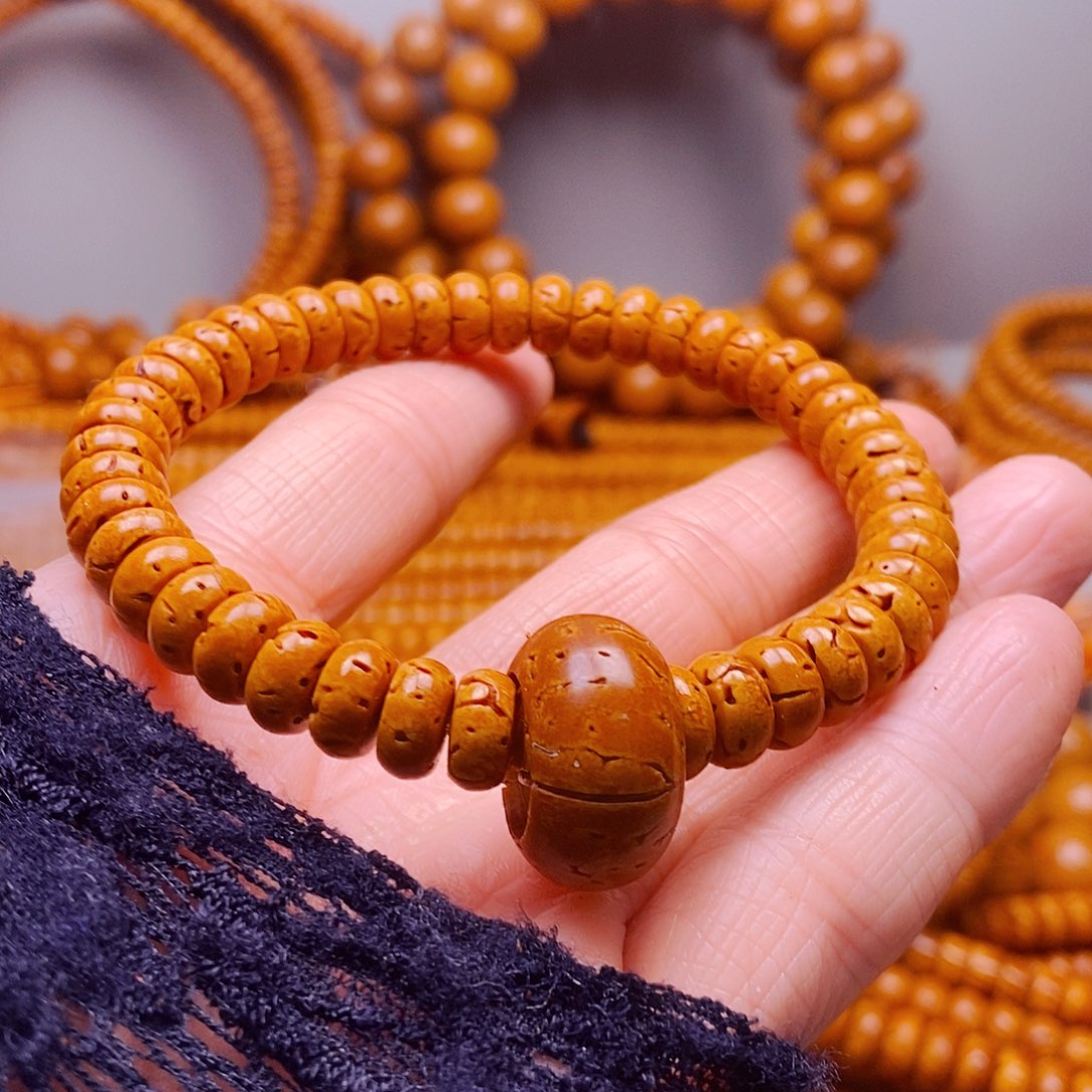 寻***金桃核吊坠4乘8核片手串精品48