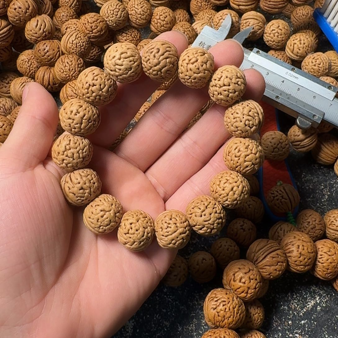 蘩***華桃核吊坠野生手串