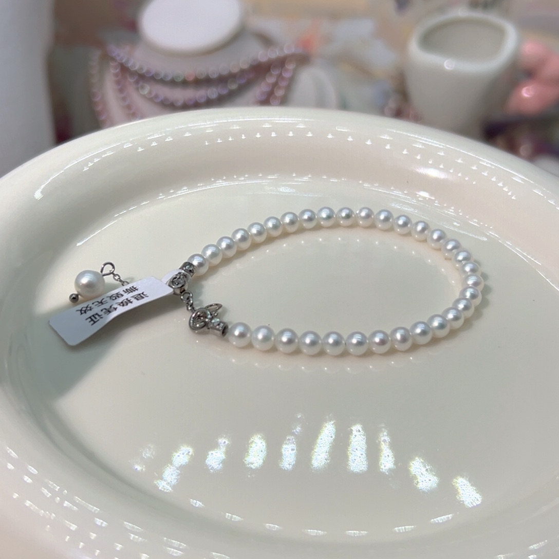 敏***麻银S925镶嵌淡水珍珠4.5左右近圆极光丝绸天然珍珠