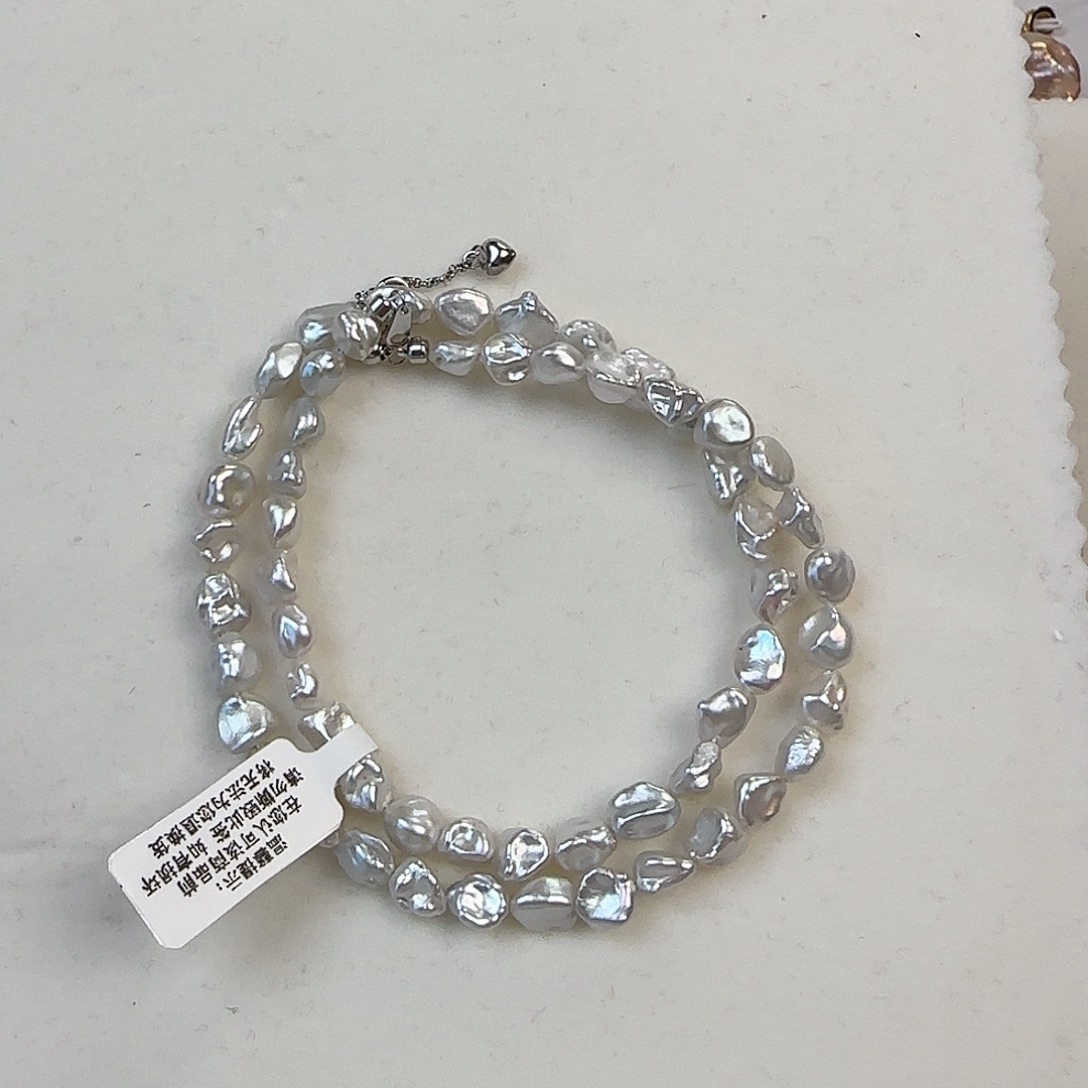 鲤***淼淡水珍珠银S925镶嵌耳饰