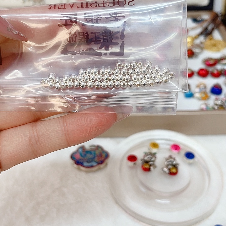 赵***告足银珐琅足银999散珠子