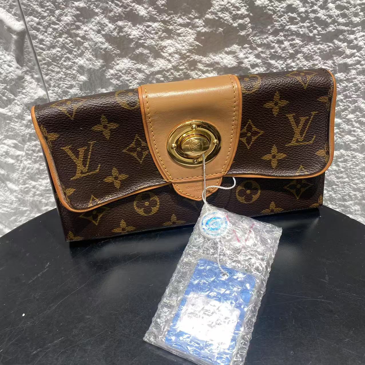 99新 LouisVuitton/路易威登 棕色印花金扣复古手拿包 wjmb004