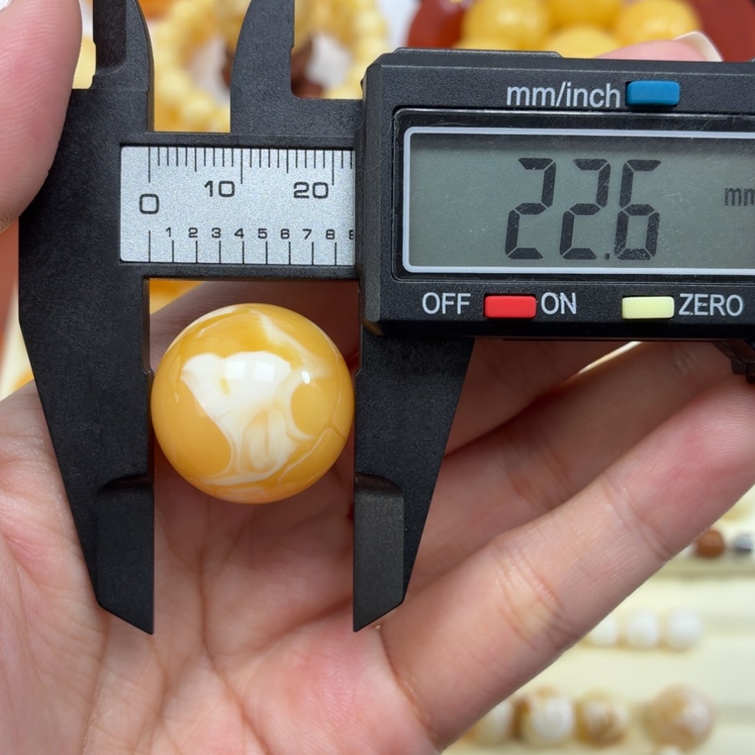 琥珀未镶嵌珠宝奇石焦皮浓橘底白纹飘花圆珠22.6mm