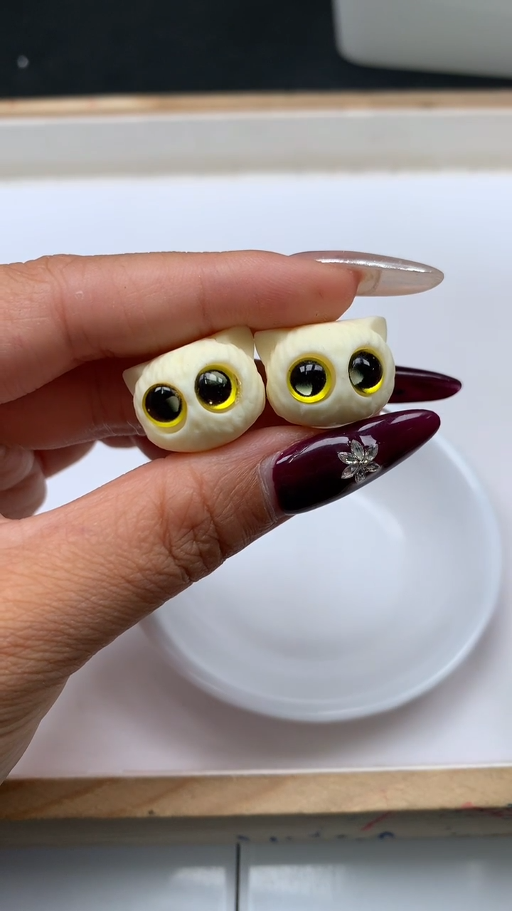 菩提散珠E882 牙 牙 果 黄眼猫头18*14mm1个5元