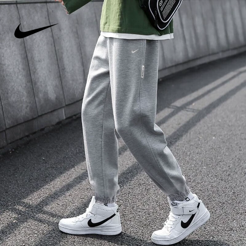NIKE/耐克灰色男裤卫裤春季新款束脚宽松运动跑步休闲长裤休闲裤