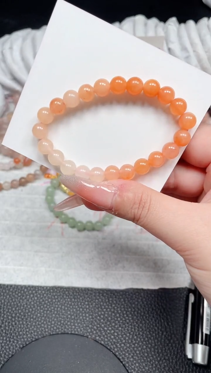 【闪购商品】石英质玉手镯未镶嵌柿子红卡8