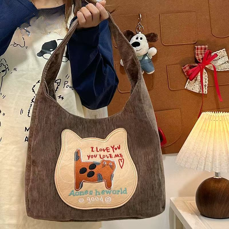 可爱猫咪饼干大容量ins单肩新款时尚复古腋下通勤包双肩