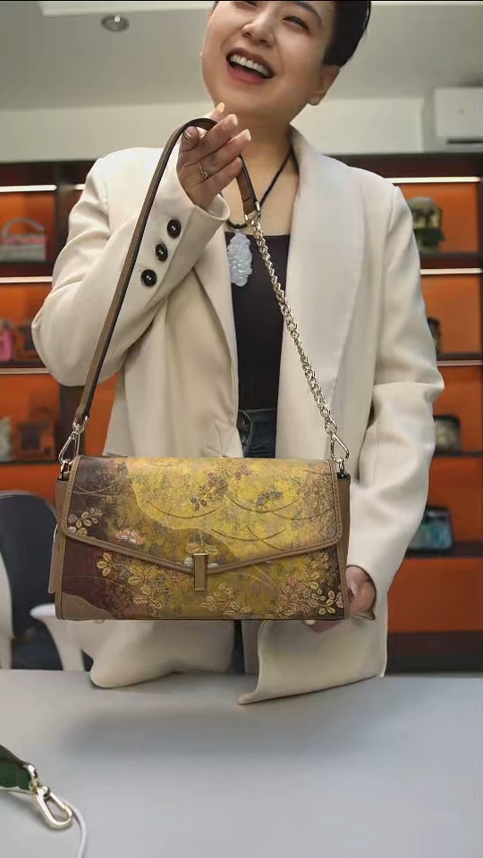 小牛皮珩*麻蝴蝶法腋下包