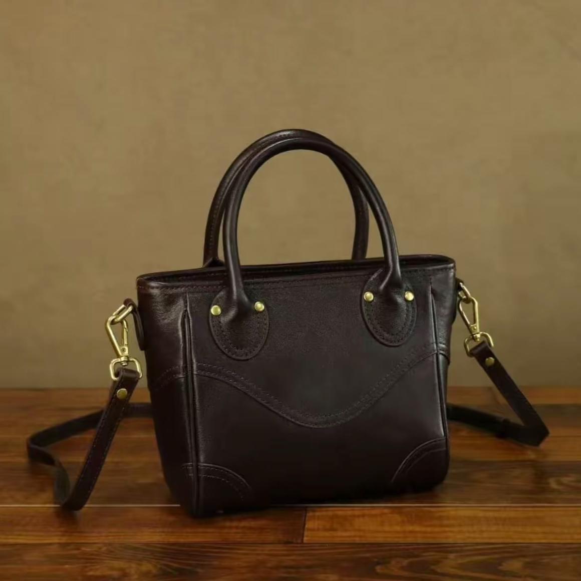 头层植鞣牛皮真皮女士包包简约复古单肩腋下斜挎笑脸菜篮包包