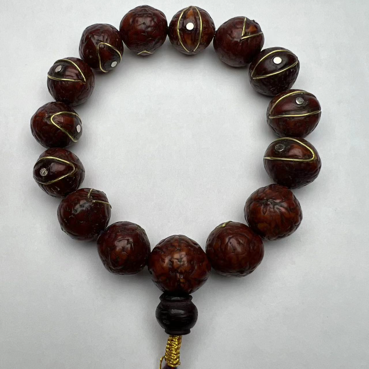 藏区凤眼菩提手串  颗颗带有铜镶嵌