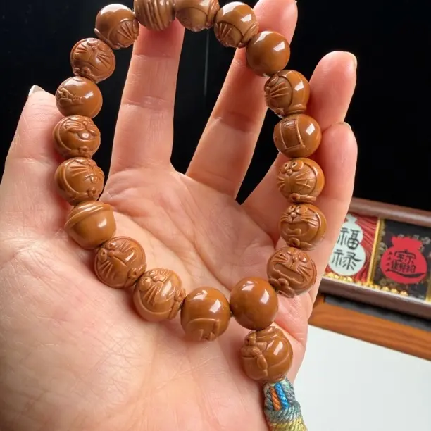 猴头哆啦a梦手持核桃文玩雕刻手工流苏款支持DIY定制